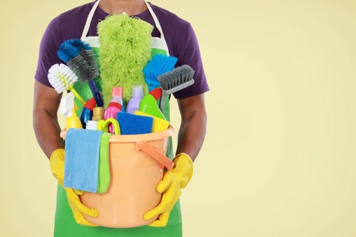 Cleaning worker using correct chemical handling procedures