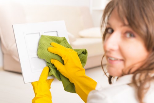 Cleaner reviewing safety measures before starting work