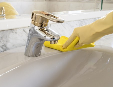 Detailed oven cleaning in a compact West London kitchen